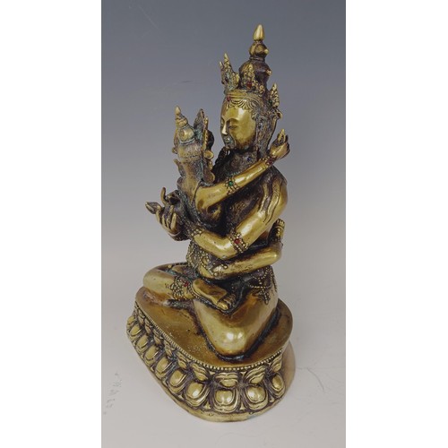 947 - A gilt bronze Buddha, 33 cm high