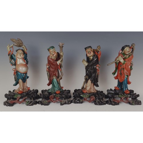 950 - A set of eight Chinese carved and painted figures, 29 cm high (8)