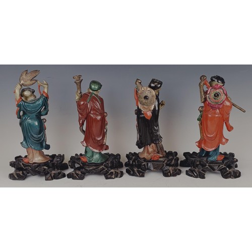 950 - A set of eight Chinese carved and painted figures, 29 cm high (8)