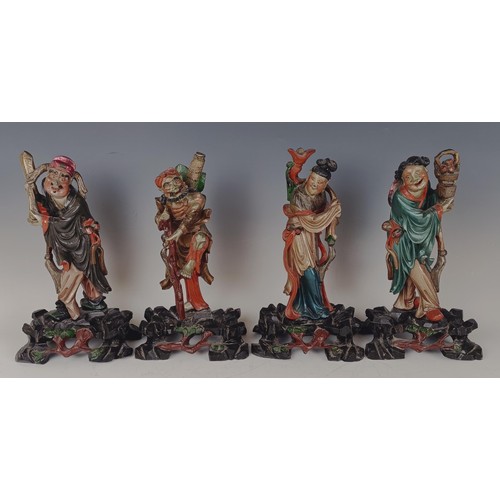 950 - A set of eight Chinese carved and painted figures, 29 cm high (8)