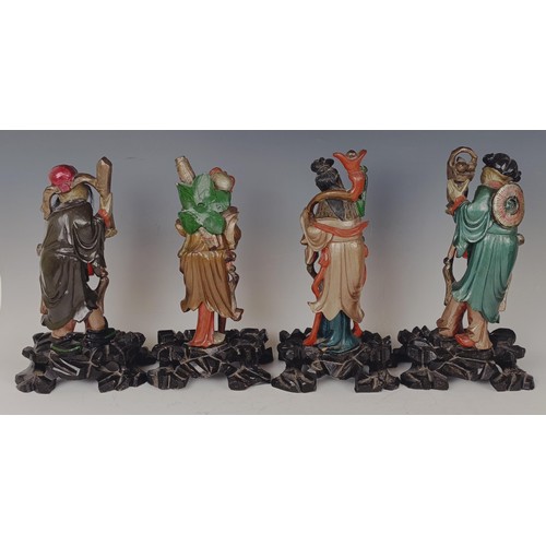 950 - A set of eight Chinese carved and painted figures, 29 cm high (8)