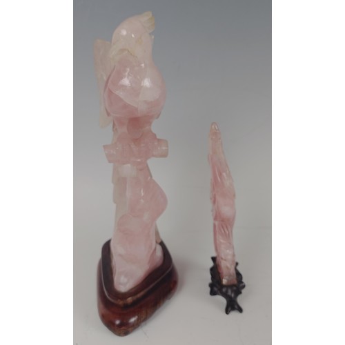 959 - A Chinese rose quartz carving of a bird, on a wooden base, 20 cm high, and another similar, 13 cm hi... 