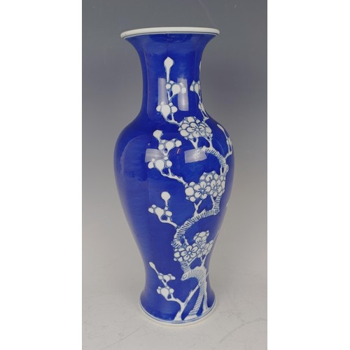 963 - A Chinese blue and white vase, decorated blossom, four character mark to base, 32 cm high