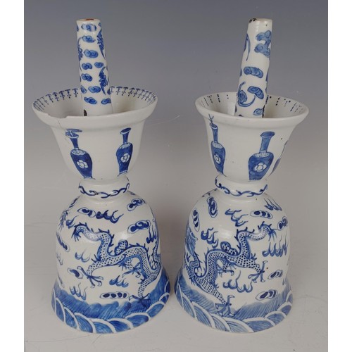 964 - A pair of Chinese blue and white oil lamps, decorated dragons chasing a flaming pearl in underglaze ... 