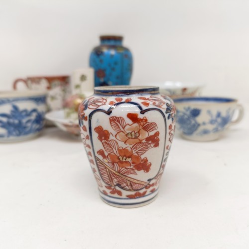 859 - A cloisonné vase, decorated flowers, 13 cm high and assorted Chinese and Japanese ceramics (qty)