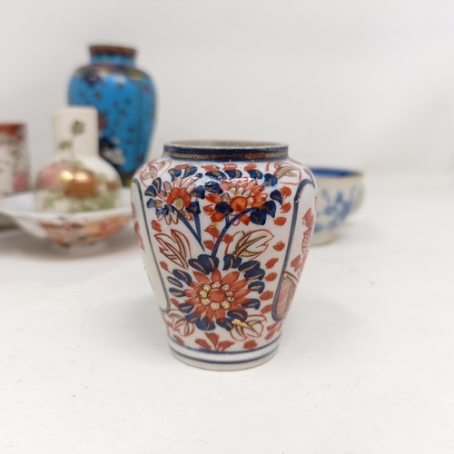 859 - A cloisonné vase, decorated flowers, 13 cm high and assorted Chinese and Japanese ceramics (qty)