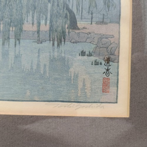 906 - A Japanese print, landscape, signed in pencil, 26 x 18 cm, and another, 18 x 26 cm (2)