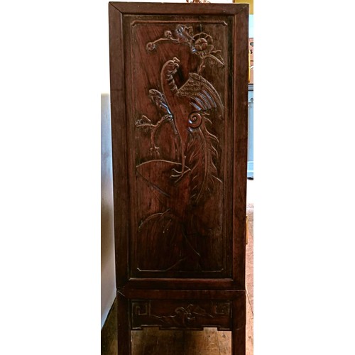 873 - A Chinese hardwood cupboard, with two cupboard doors and a single drawer, carved dragons, 76 cm wide