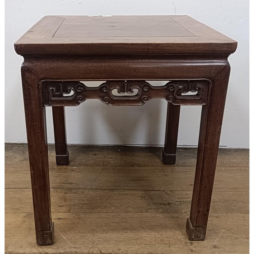 875 - A Chinese carved low table, with a pierced freize, 45 cm wide