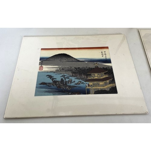 979 - A Japanese print, of a donkey and two figures, 15 x 23 cm, another, tented village, with figures, 14... 