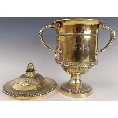 11 - A good George V silver gilt trophy cup and cover, engraved 'Esher Cup 1928, Won by Seagray', the cov...