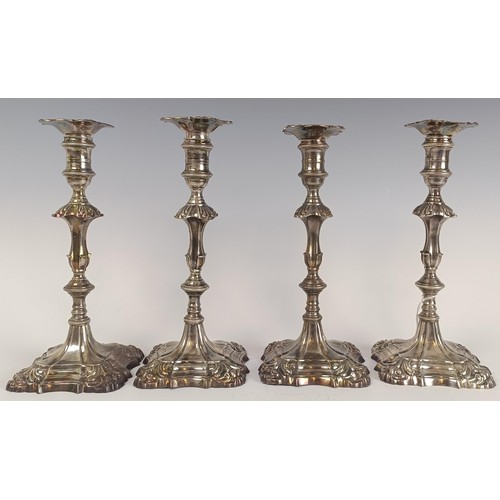 13 - Two matching pairs of mid 18th century cast silver candlesticks, London 1757 and 1763, 61.7 ozt, 26 ... 