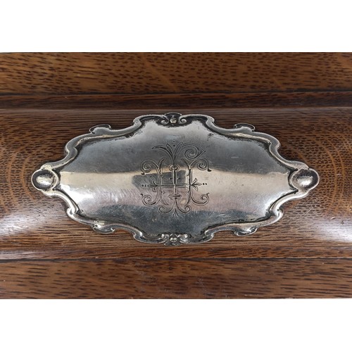 14 - A late Victorian silver and oak casket, monogrammed and inscribed 'Presented to James Holmes.....190... 