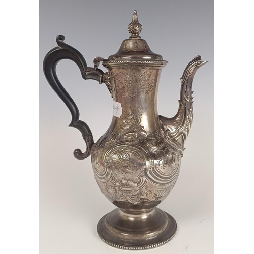 20 - A George III silver coffee pot, with embossed decoration, London 1775, 30.5 ozt (all in), 30 cm high...