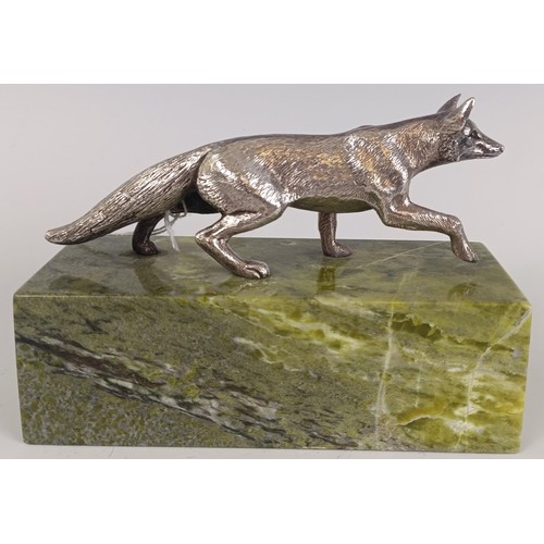 45 - A silver coloured metal model of a fox, on a marble base, with a silver plaque engraved 'Nick and Xa...