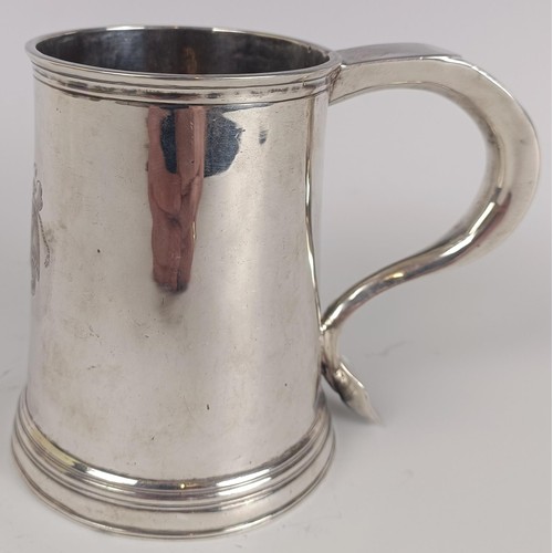 48 - A 18th century silver pint mug, engraved an armorial and initialed on the handle, makers mark only, ...