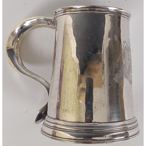 48 - A 18th century silver pint mug, engraved an armorial and initialed on the handle, makers mark only, ...