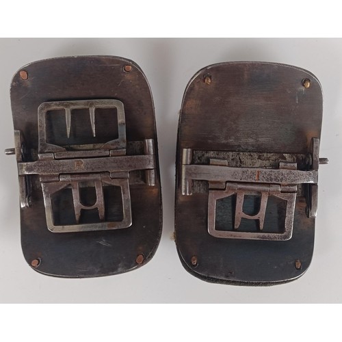 53 - A pair of silver coloured metal and leather shoe buckles, and another pair similar, both cased (2)