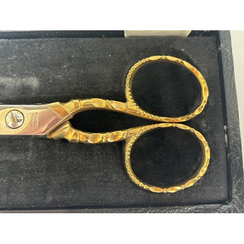 62 - A pair of gilt metal ceremonial scissors, cased