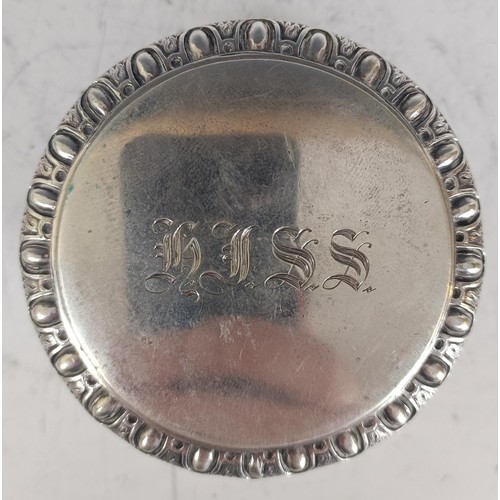 66 - A Continental silver coloured metal and gilt snuff box, initialed, 7 cm diameter