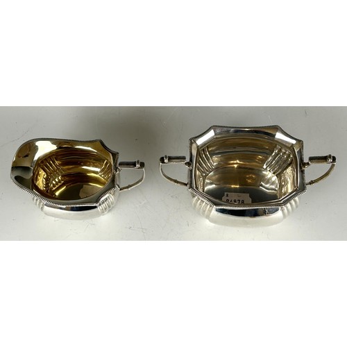 67 - A George V silver sugar bowl, and a silver cream jug, Sheffield 1913, 15.1 ozt (2)...