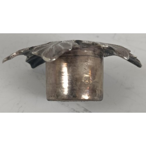 69 - A Victorian silver novelty chamberstick, in the form of leaves, with a candle snuffer, Birmingham 18...