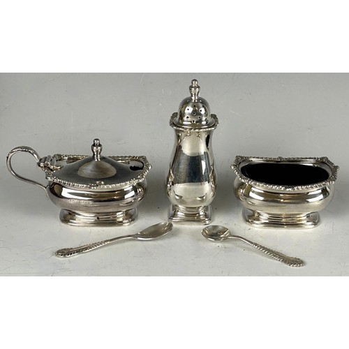 85 - A silver three piece cruet set, in a fitted box, Birmingham 1962, and a silver butter knife, silver ... 