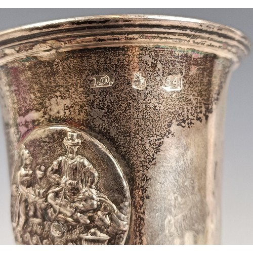 86 - A 19th century Russian silver coloured metal goblet, decorated figures, 84 standard, loaded, 20 cm h... 