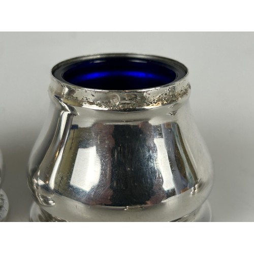 93 - A silver coloured metal salt and pepper, in a fitted case