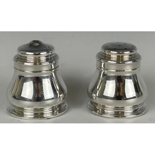 93 - A silver coloured metal salt and pepper, in a fitted case