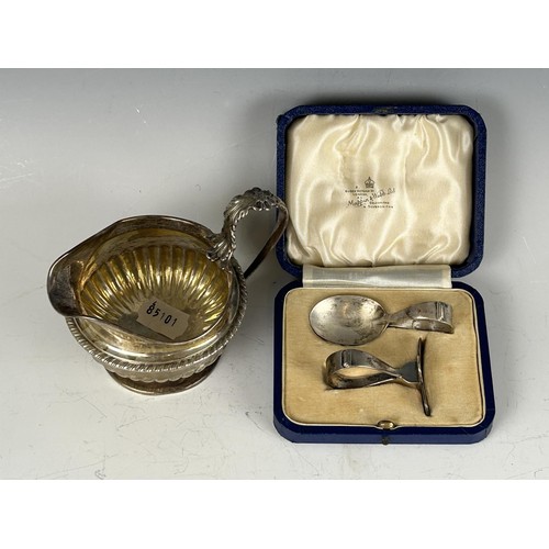 100 - A 19th century silver cream jug, marks rubbed, and a baby's push and spoon, cased, 8.2 ozt (2)