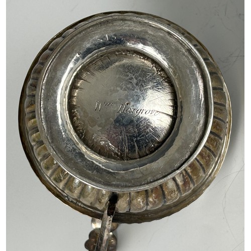 100 - A 19th century silver cream jug, marks rubbed, and a baby's push and spoon, cased, 8.2 ozt (2)