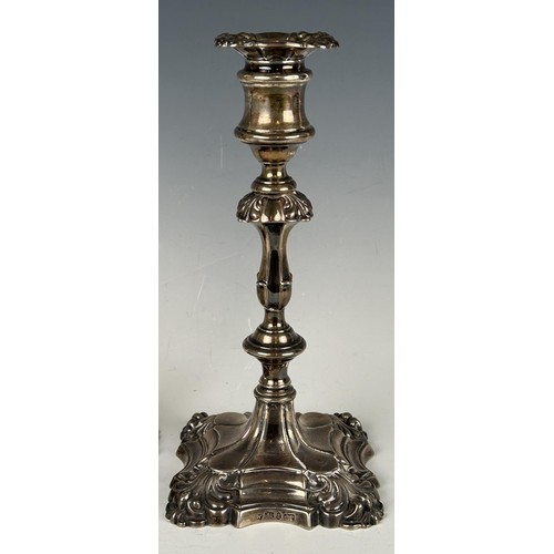 102 - A pair of William IV  cast silver candlesticks, Sheffield 1837, 15.2 ozt, 24 cm high