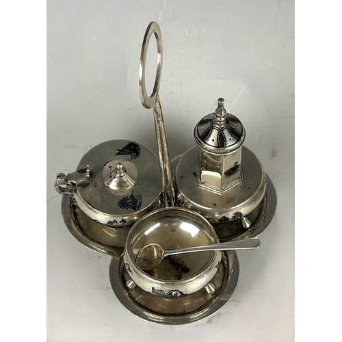 112 - An Eastern silver coloured metal cruet, comprising a pepperpot, a salt, and a mustard pot, on a stan... 