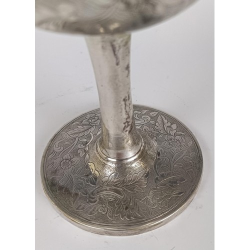 119 - A 19th century silver coloured metal goblet, initialed and dated 1863, with floral decoration, appar... 