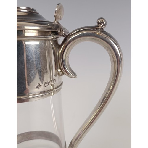 127 - A late Victorian silver and glass claret jug, London 1894, 20 cm high