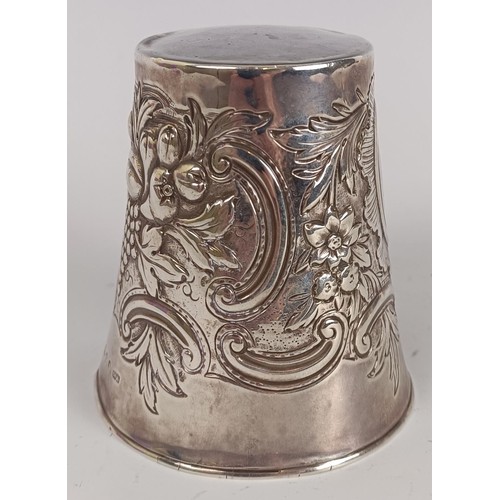 132 - A 19th century silver beaker, initialed, with embossed decoration, probably Edinburgh 1833, 3.7 ozt,... 