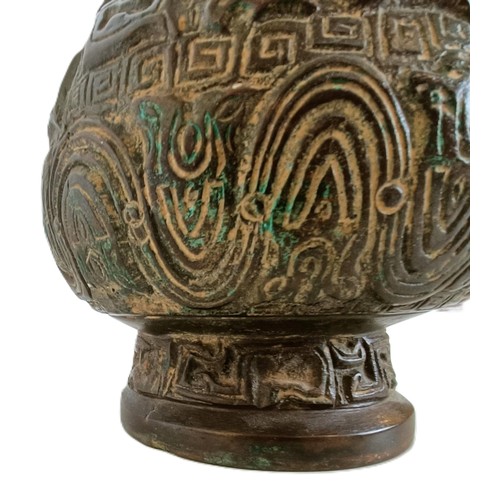 962 - A Chinese bronze vase, with ring handles, 30 cm high, on a wooden base, converted to a lamp