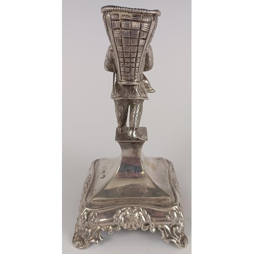 136 - A rare Portuguese silver coloured metal figural toothpick holder, on a square base, 13.5 cm high