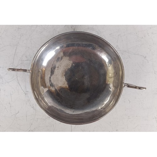 141 - An 18th century silver porringer, marks indistinct, 6.6 ozt, 27.5 cm wide