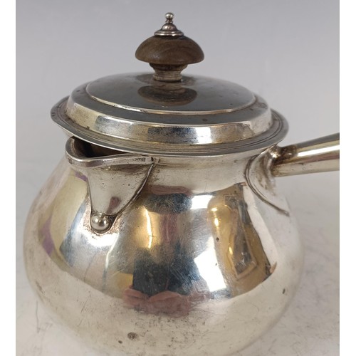 144 - A George III silver brandy pan and lid, with a wooden handle, London 1775, 14.2 ozt all in, 25 cm wi... 