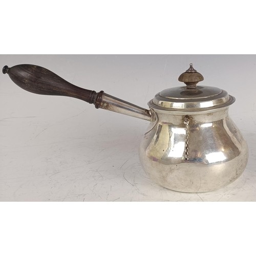 144 - A George III silver brandy pan and lid, with a wooden handle, London 1775, 14.2 ozt all in, 25 cm wi... 