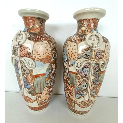 951 - A pair of Japanese vases, decorated figures, highlighted in gilt, 32 cm high (2)