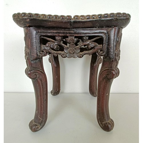 944 - A Chinese carved hardwood stand, the top inset with marble, 19 cm wide