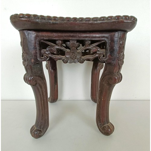 944 - A Chinese carved hardwood stand, the top inset with marble, 19 cm wide