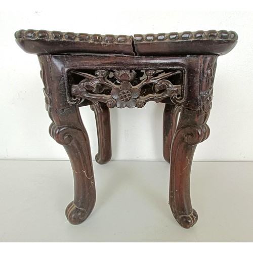 944 - A Chinese carved hardwood stand, the top inset with marble, 19 cm wide