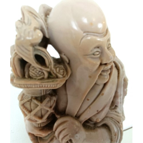 958 - A Chinese hardstone carving of a man, 25 cm high