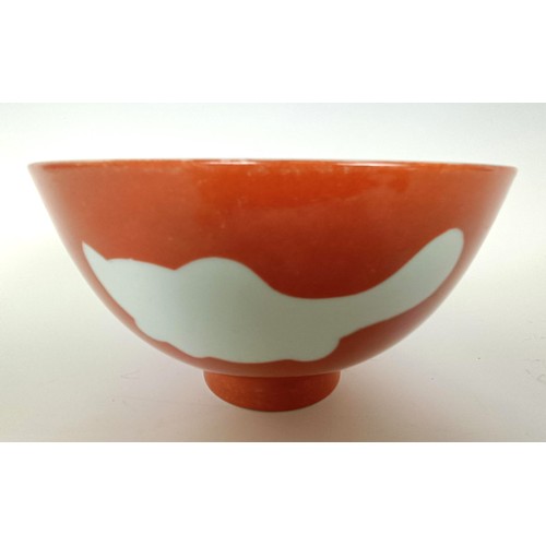 988 - A Chinese coral glazed bowl, decorated fish, Qianlong mark to base, 15 cm diameter