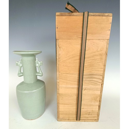 986 - A Chinese celadon vase, in a wooden case, 27 cm high