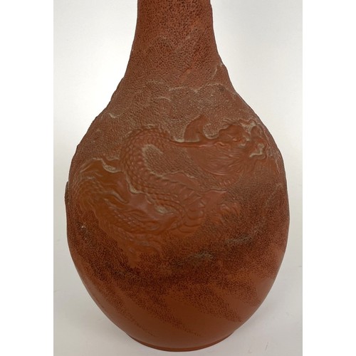 863 - A Chinese pottery bottle vase, decorated a dragon, character mark to base, 28 cm high